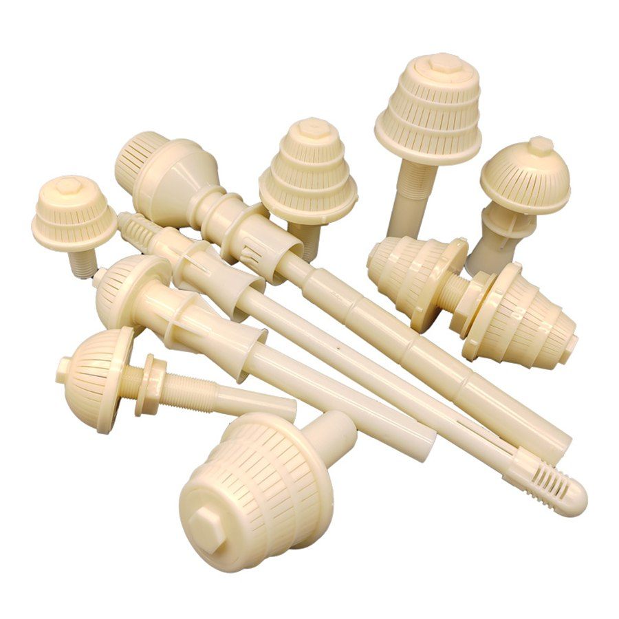 ABS filter nozzles arranged in a row on a white background