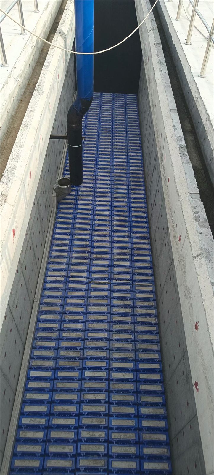 Filter bricks laid in rows in a filter tank channel on site
