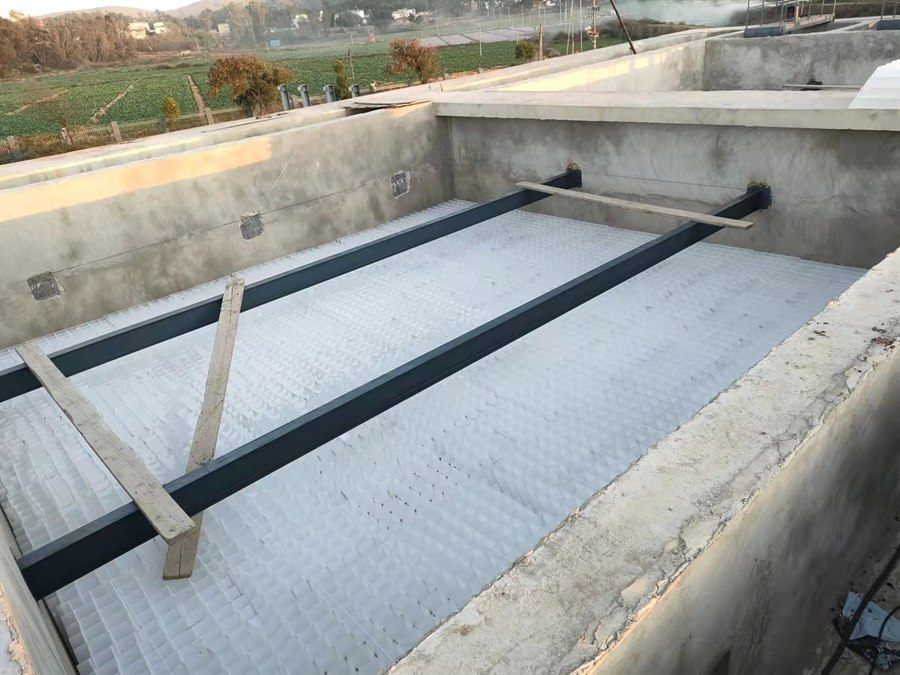 Inclined plate media installed in a settling basin