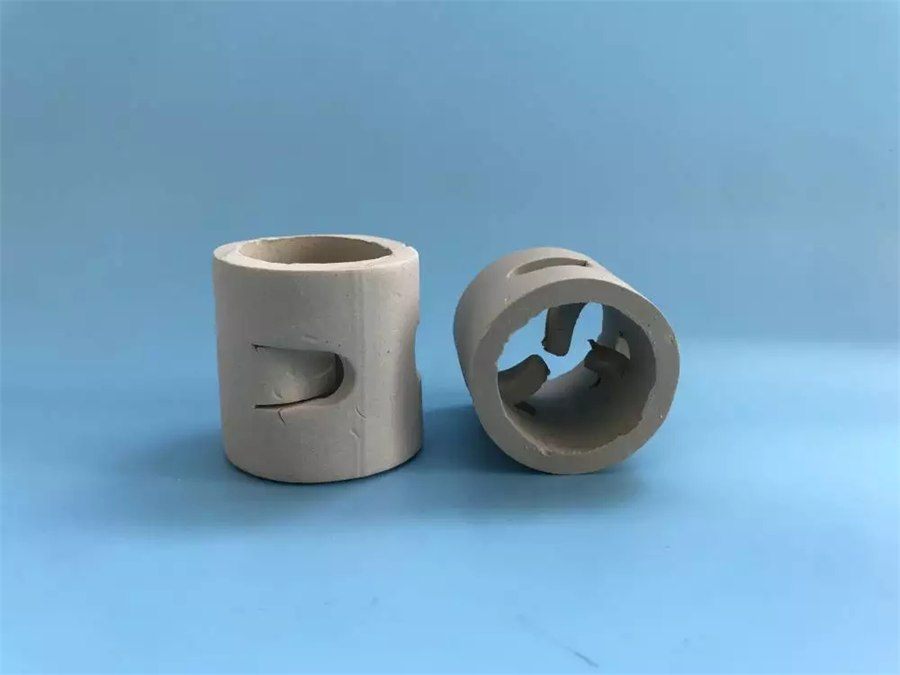 Grey Pall rings, two pieces on a blue background, one upright and one on its side