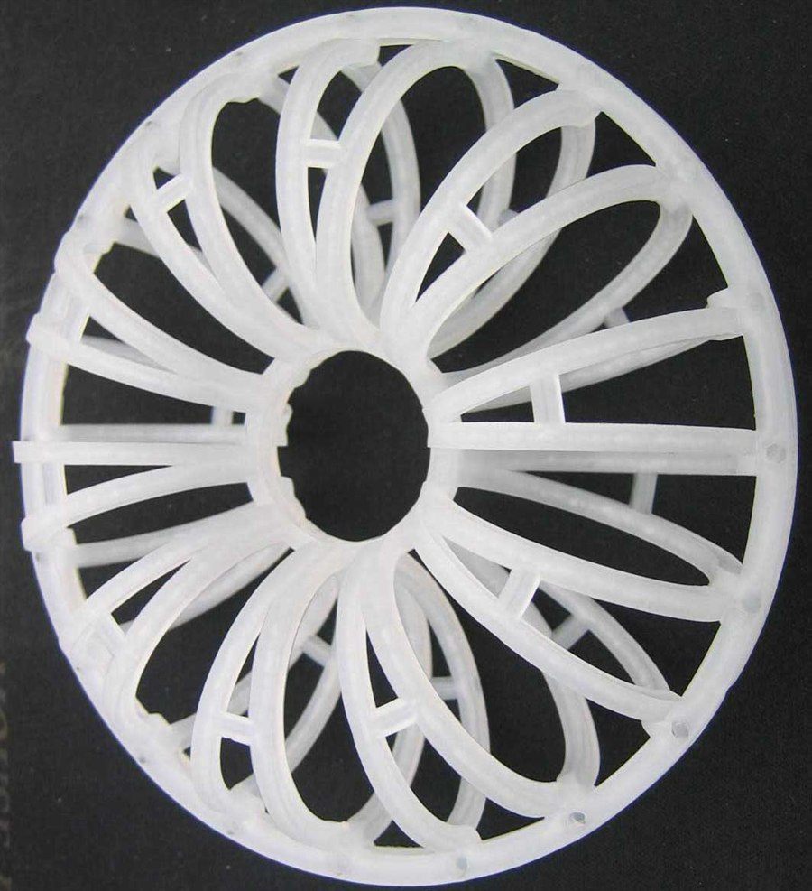 White Teller Rosette Ring seen face-on against a black background