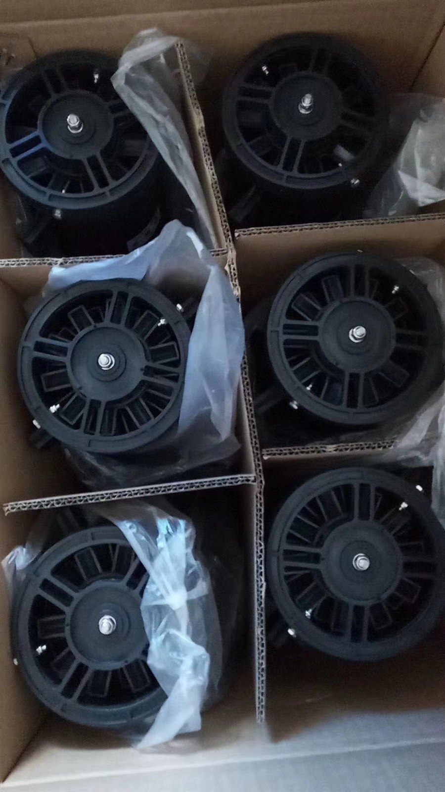 Packed vortex aerator end plates with radial vanes, each unit bagged in its carton