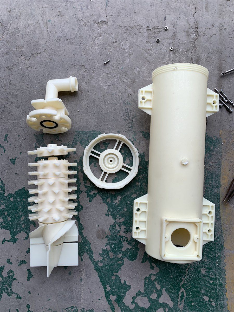 Internal vortex element with its ribbed spiked body and four-blade head beside the barrel