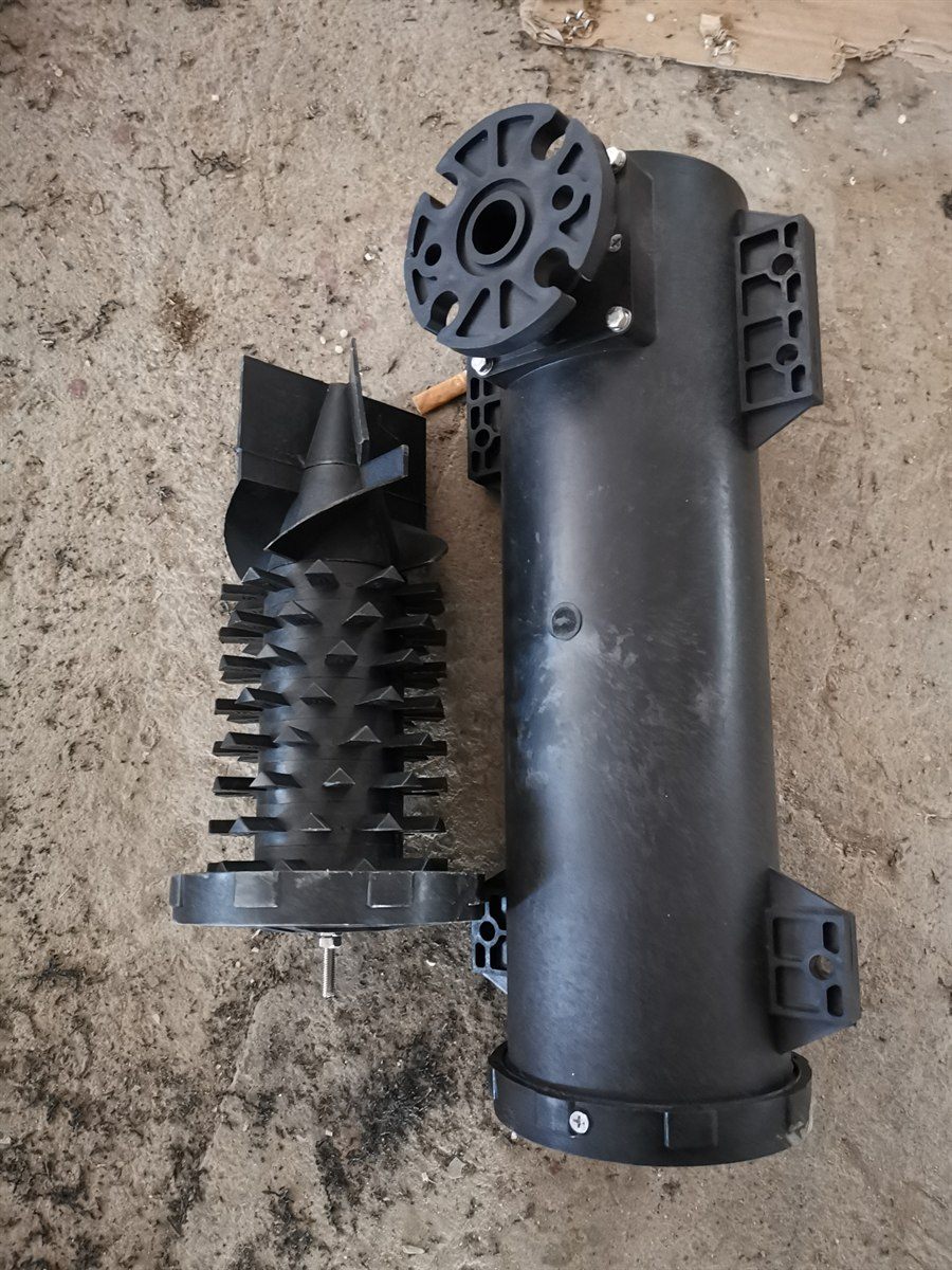 Vortex aerator barrel showing the base inlet opening beside the ribbed internal element