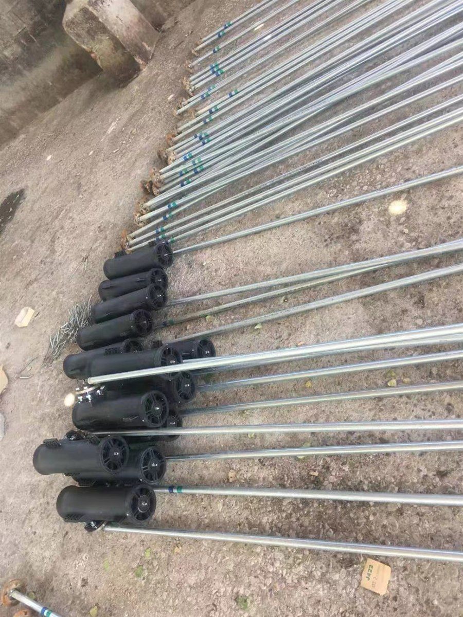 End plates and riser pipes viewed along a row of finished vortex aerator units